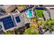 An aerial view featuring a backyard with a pool, spa, and solar panels in a Las Vegas neighborhood at 6005 Crystal Talon St, Las Vegas, NV 89130