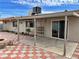 The backyard features a covered patio, a fire pit, and checkerboard-tiled sections at 6216 Bullion Blvd, Las Vegas, NV 89103