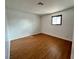 Bedroom features wood-look floors, white walls, a small window and electrical outlets at 6216 Bullion Blvd, Las Vegas, NV 89103