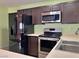 Kitchen with stainless appliances, double door refrigerator, and light countertop at 6216 Bullion Blvd, Las Vegas, NV 89103