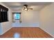 Living room with wood floors, a ceiling fan, and natural light at 6216 Bullion Blvd, Las Vegas, NV 89103