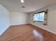 Spacious living room with wood floors, a window, and recessed lighting at 6216 Bullion Blvd, Las Vegas, NV 89103