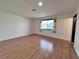 Open living room with wood floors and a view of the exterior at 6216 Bullion Blvd, Las Vegas, NV 89103