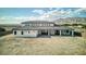 A sprawling backyard featuring a large covered patio, showcasing the expansive outdoor living space at 6383 Horse Dr, Las Vegas, NV 89131