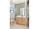 Stylish bathroom with a wood vanity, green backsplash and a glass shower stall at 6383 Horse Dr, Las Vegas, NV 89131