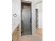 Stylish bathroom with a wood vanity and glass shower stall at 6383 Horse Dr, Las Vegas, NV 89131