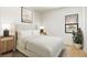 Cozy bedroom featuring a comfortable bed, stylish lamps, and a view from the window at 6383 Horse Dr, Las Vegas, NV 89131