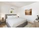 A modern bedroom with hardwood floors, neutral colors, and stylish furniture at 6383 Horse Dr, Las Vegas, NV 89131