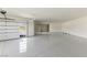 Large and airy garage with epoxy flooring and a modern door at 6383 Horse Dr, Las Vegas, NV 89131