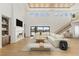 Bright living room features tall ceilings, fireplace and large sliding doors to enhance indoor/outdoor flow at 6383 Horse Dr, Las Vegas, NV 89131