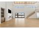 Bright living room features tall ceilings and large sliding doors to enhance indoor/outdoor flow at 6383 Horse Dr, Las Vegas, NV 89131