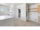Spacious walk-in closet with custom cabinets, drawers and an entry to the bathroom at 6383 Horse Dr, Las Vegas, NV 89131