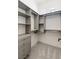 Spacious walk-in closet boasts custom shelving, ample storage, and plush carpeting, providing an organized and luxurious space at 6383 Horse Dr, Las Vegas, NV 89131