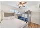 Bedroom featuring a double bed, bunk beds, and a ceiling fan at 6408 Starcrest Dr, Las Vegas, NV 89108