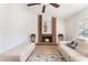 Cozy living room featuring a brick fireplace and neutral decor at 6408 Starcrest Dr, Las Vegas, NV 89108