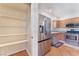 Kitchen pantry with plentiful shelving and a stainless steel refrigerator at 6408 Starcrest Dr, Las Vegas, NV 89108