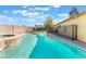Inviting pool and spa area with a privacy fence and a view of the lush backyard at 6408 Starcrest Dr, Las Vegas, NV 89108