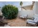 Private backyard seating area with gravel and shrubbery at 700 Aztec Cir # 12B, Mesquite, NV 89027