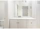 Bathroom featuring a vanity with white cabinets and a large mirror at 700 Aztec Cir # 12B, Mesquite, NV 89027