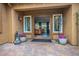 Picturesque view from the courtyard of the desert landscaping framed by the covered walkway at 7231 Adobe Hills Ave, Las Vegas, NV 89113