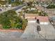 Residential single-Gathering home with a circular driveway, three-car garage, and well-maintained landscaping at 788 Rossmore Dr, Las Vegas, NV 89110