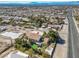 An aerial view of a home with a long driveway and desert landscape at 788 Rossmore Dr, Las Vegas, NV 89110