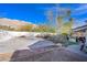 Mountains in view beyond the backyard featuring partial outdoor kitchen view at 788 Rossmore Dr, Las Vegas, NV 89110