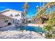 Charming backyard features a sparkling pool with lush tropical landscaping at 788 Rossmore Dr, Las Vegas, NV 89110