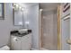 Bathroom featuring a stylish vanity with a vessel sink and a shower, offering a functional and clean design at 788 Rossmore Dr, Las Vegas, NV 89110