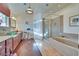 Bathroom features a vanity with lots of storage and glass enclosed shower at 788 Rossmore Dr, Las Vegas, NV 89110