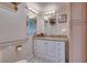 Bright bathroom with double vanity, granite countertop, and storage at 788 Rossmore Dr, Las Vegas, NV 89110