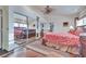Bedroom features a mirrored closet, wood floors, and a ceiling fan at 788 Rossmore Dr, Las Vegas, NV 89110