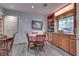 Charming dining area with built-in cabinets, a window view, and hardwood flooring, perfect for entertaining at 788 Rossmore Dr, Las Vegas, NV 89110