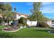 Single-Gathering home with beautiful landscaping, a circular driveway, and a 3-car garage at 788 Rossmore Dr, Las Vegas, NV 89110