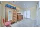 Bright hallway with a vintage cabinet and mirror, leading to a bright room at 788 Rossmore Dr, Las Vegas, NV 89110