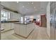 Spacious kitchen featuring white cabinets, granite countertops, and an island for casual dining at 788 Rossmore Dr, Las Vegas, NV 89110