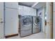 Convenient laundry room featuring modern washer and dryer, along with ample cabinet space for storage at 788 Rossmore Dr, Las Vegas, NV 89110