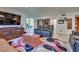 Comfortable living room with an entertainment center, large window, and neutral decor at 788 Rossmore Dr, Las Vegas, NV 89110