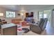 Comfortable living room with an entertainment center, large window, and neutral decor at 788 Rossmore Dr, Las Vegas, NV 89110