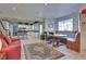Open-concept living room with an adjacent breakfast nook and view into the kitchen at 788 Rossmore Dr, Las Vegas, NV 89110
