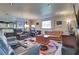 Comfortable living room with multiple sofas, an entertainment center, and neutral decor at 788 Rossmore Dr, Las Vegas, NV 89110