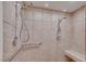 Close-up of tiled shower with dual shower heads and grab bar at 788 Rossmore Dr, Las Vegas, NV 89110