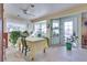Bright sunroom filled with natural light and numerous plants, creating a serene space at 788 Rossmore Dr, Las Vegas, NV 89110