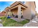 Covered back patio with a swing set and mountain views in the distance at 7884 Patagonia Point Ct, Las Vegas, NV 89179