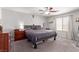Comfortable bedroom with a ceiling fan, a window and classic decor at 7884 Patagonia Point Ct, Las Vegas, NV 89179