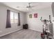 Bright bedroom with neutral tones, a ceiling fan, artwork, a window with curtains, and an exercise bike at 7884 Patagonia Point Ct, Las Vegas, NV 89179