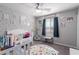 Charming bedroom featuring educational decor, study area, alphabet rug, and bright, inviting colors at 7884 Patagonia Point Ct, Las Vegas, NV 89179