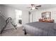 Spacious bedroom with a ceiling fan, and access to the ensuite bathroom at 7884 Patagonia Point Ct, Las Vegas, NV 89179