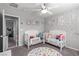 Bright bedroom with two beds, educational decor, and a fun, colorful alphabet rug at 7884 Patagonia Point Ct, Las Vegas, NV 89179
