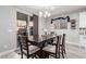 Cozy dining area with a wooden table, chairs, and access to the outdoors at 7884 Patagonia Point Ct, Las Vegas, NV 89179